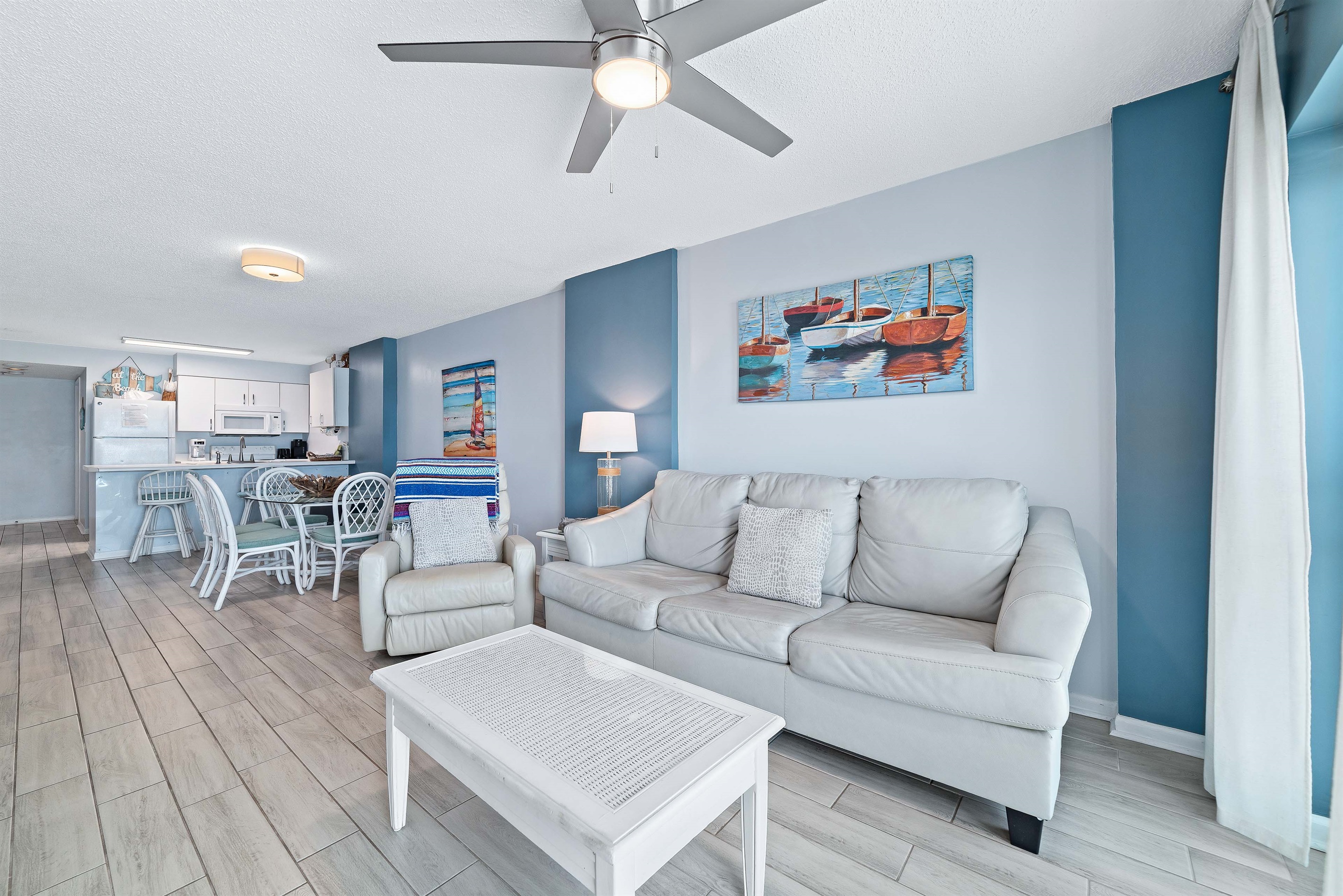 An inviting open-concept living and dining area, perfect for entertaining or relaxing in comfort.