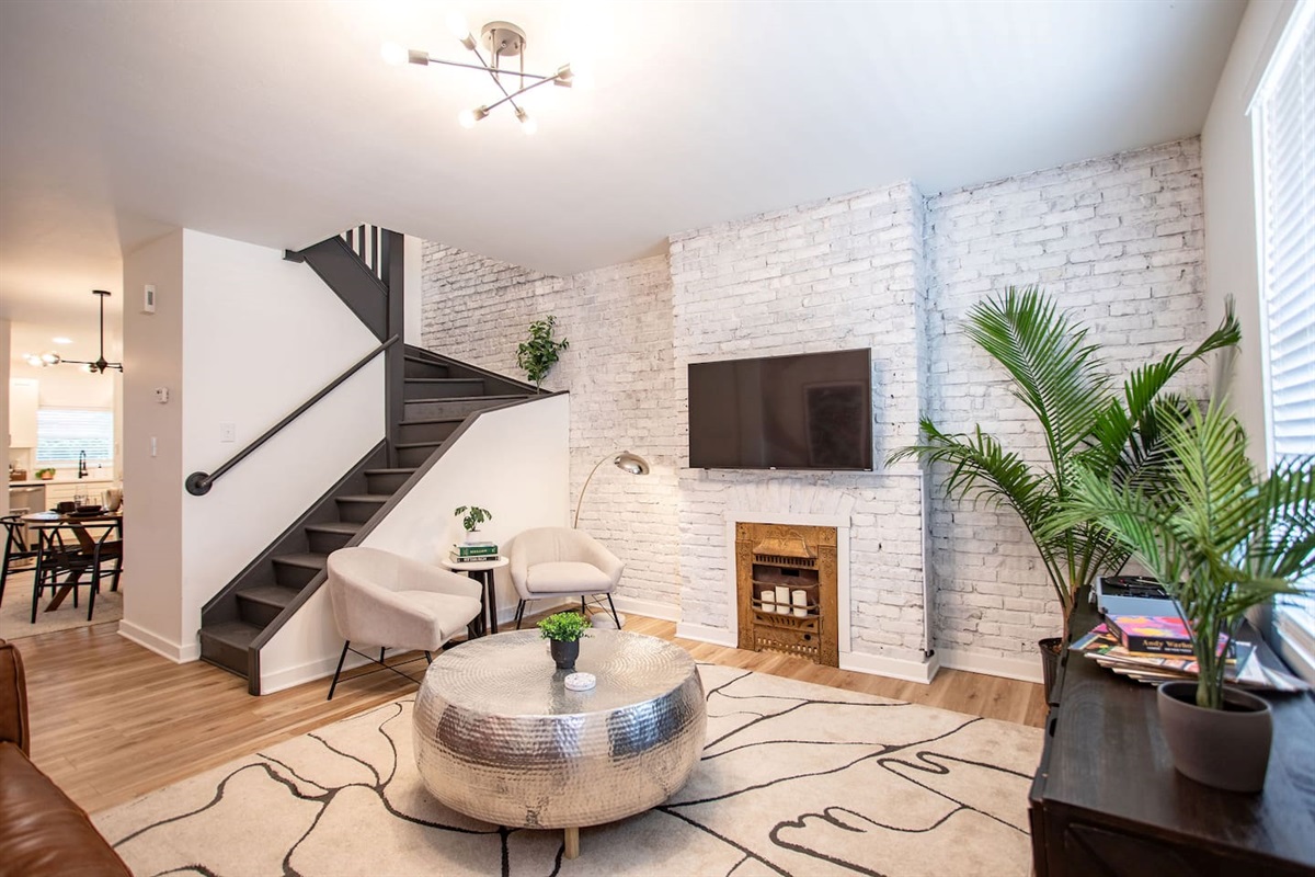 Bright and airy living room with a clean, white interior, creating a fresh and minimalist space that's perfect for relaxation and unwinding.