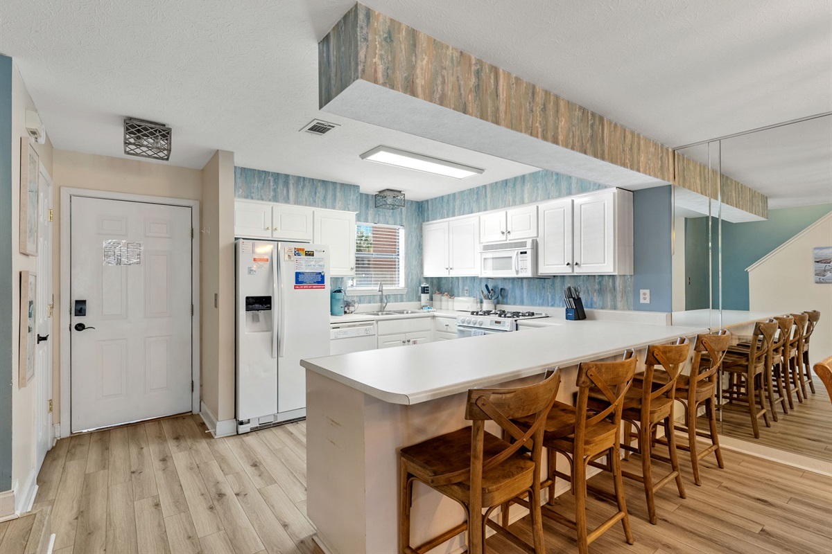 Open kitchen with bar seating