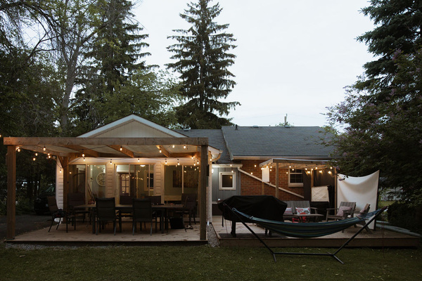 Your home for outdoor moments: roomy deck space and firewood ready for use.