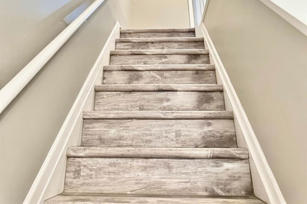 Stairway to Adventure: Brightly lit stairs leading you to your seaside getaway!