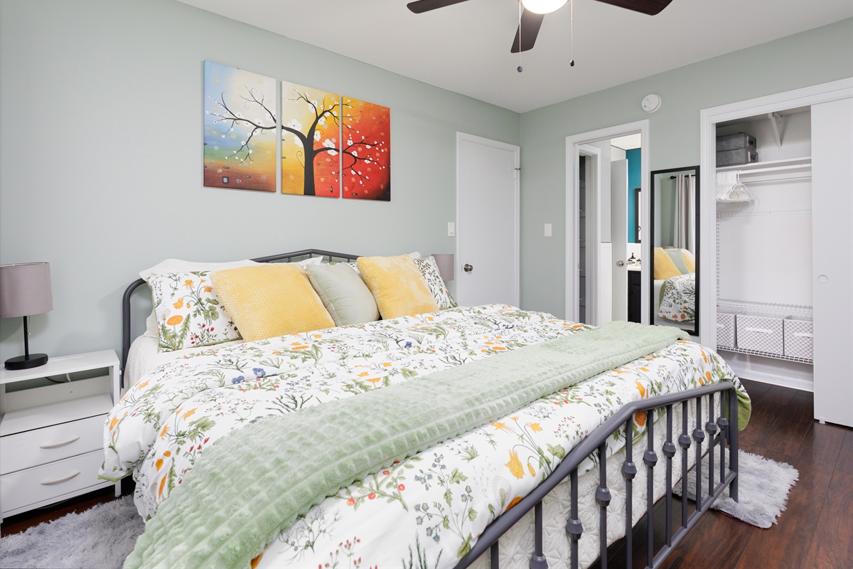 Primary bedroom highlighting generous floor space, closet with extra linens and storage and direct bathroom access.
