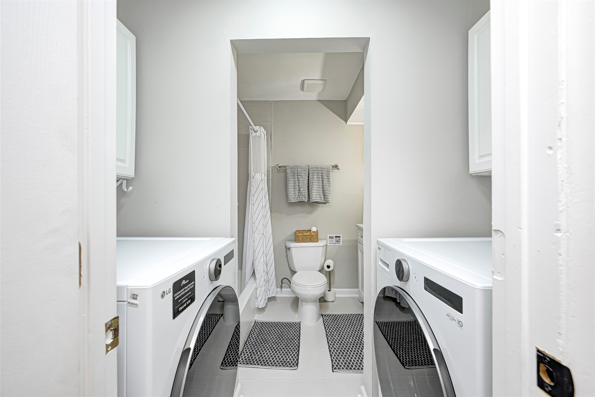 Convenient full bathroom with in-unit washer and dryer — perfect for longer stays and family travel