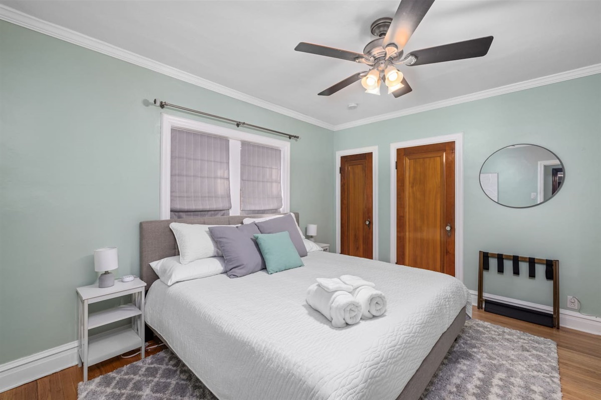 Main level bedroom 2 has a medium firm mattress with removable mattress topper to suit your preference, 43" flat screen smart TV, night stands and bedside lamps with USB charging stations and ceiling fan.  Dresser and closet for storage.