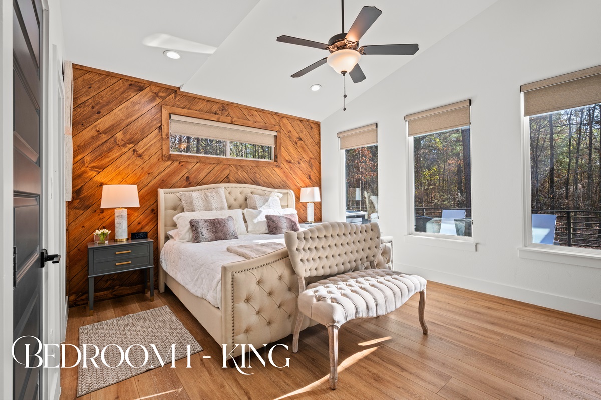 The primary king bedroom offers a calm, inviting retreat with warm wood accents and plenty of natural light.