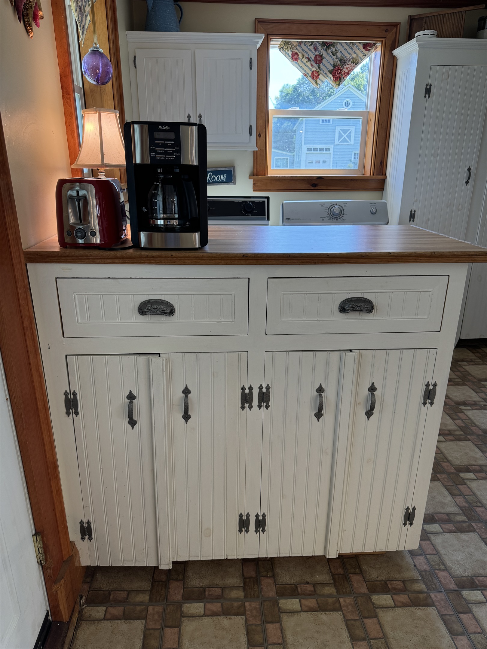 Coffee station with laundry beyond