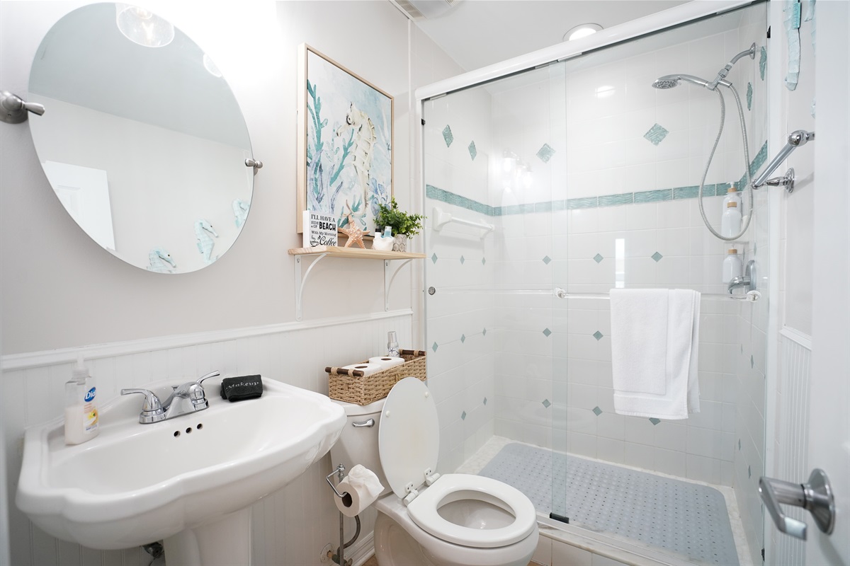 Bathroom 1 is fully renovated with a walk-in shower.