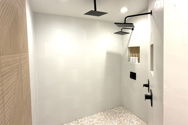 Oversized spa-inspired Primary sanctuary shower with three large rain shower heads