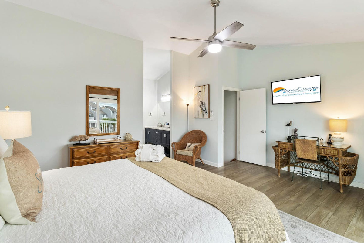 Set up at the dedicated desk or stream from the Smart TV &mdash; the king master suite handles both modes.