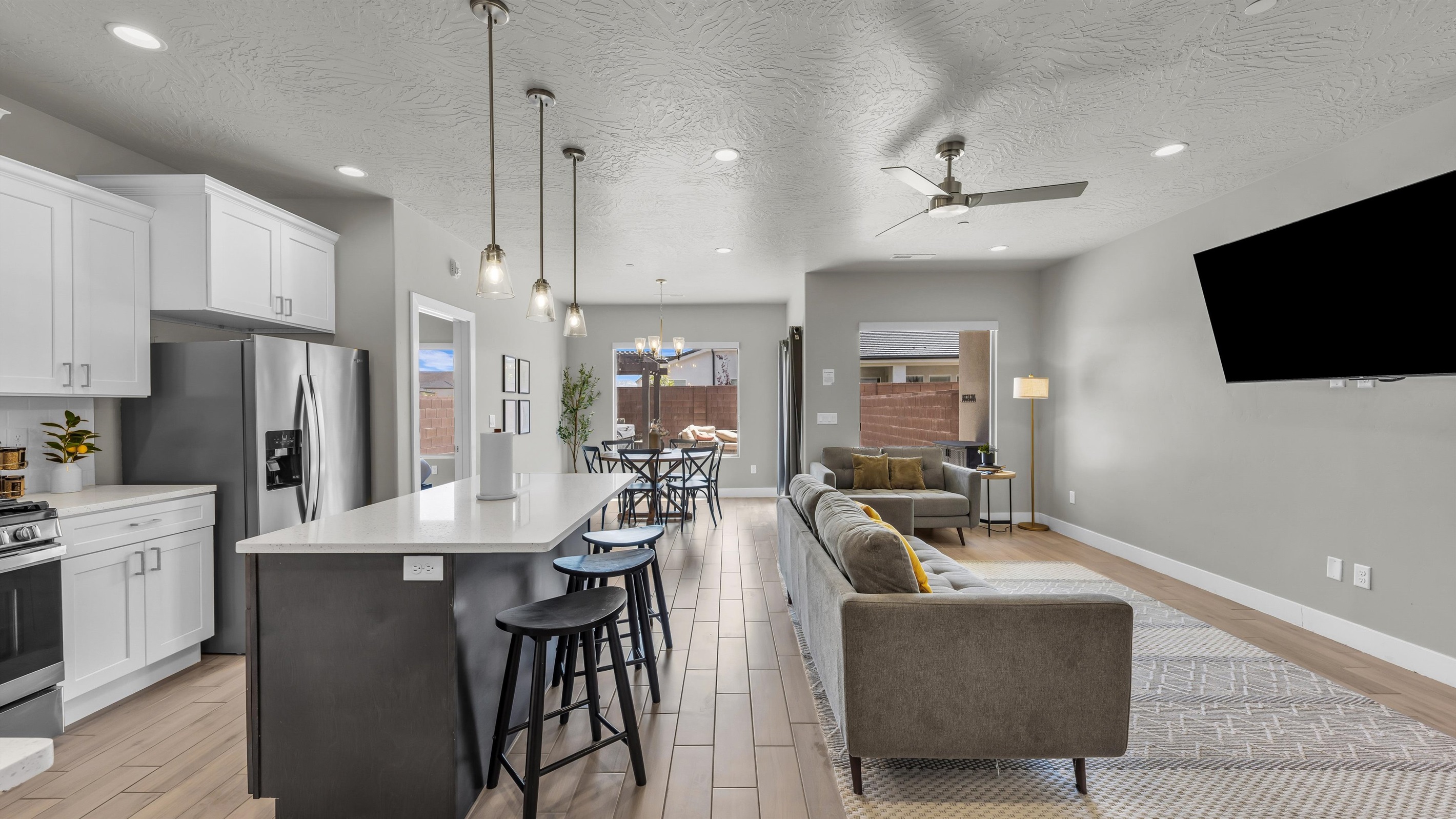 Open-Concept Kitchen Island Flowing to Living Area