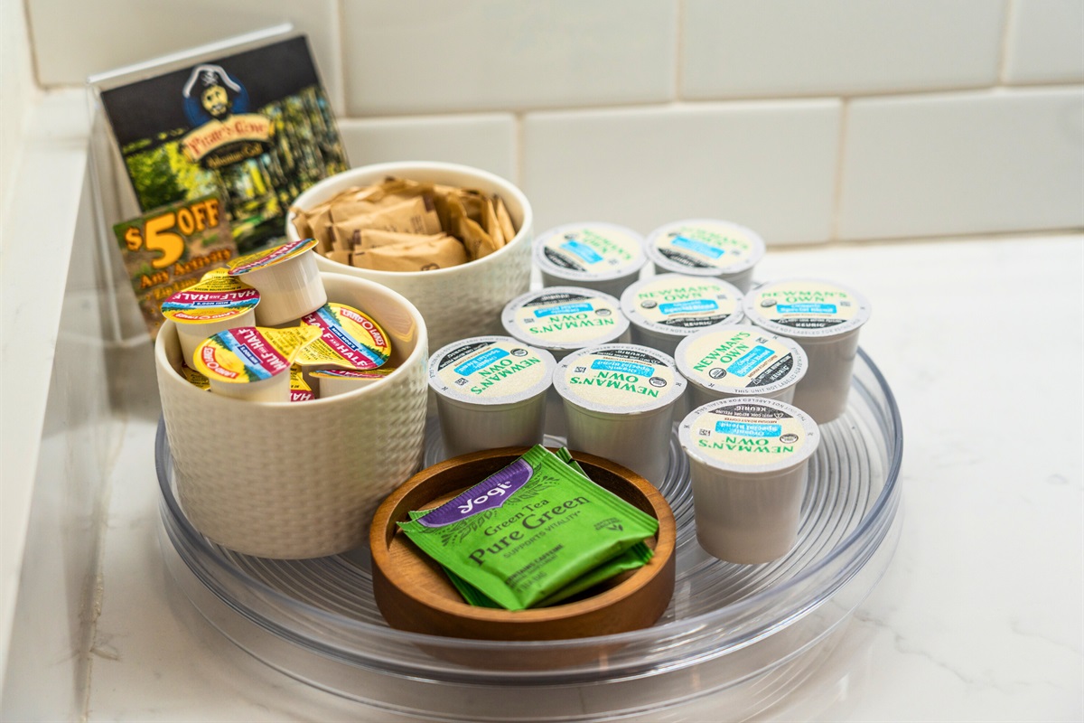 Thoughtful welcome tray with coffee pods, tea, and snacks to make your stay even sweeter.