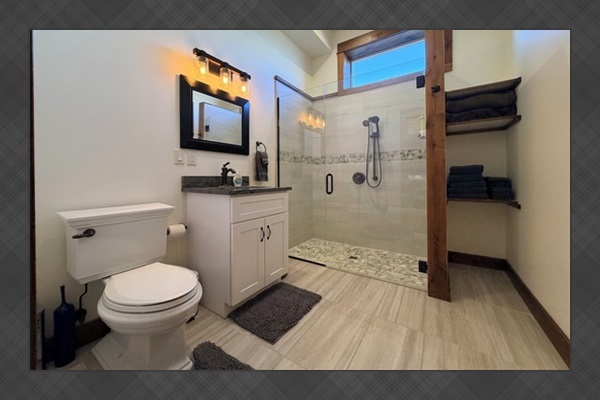 The suite features a full walk in shower.
