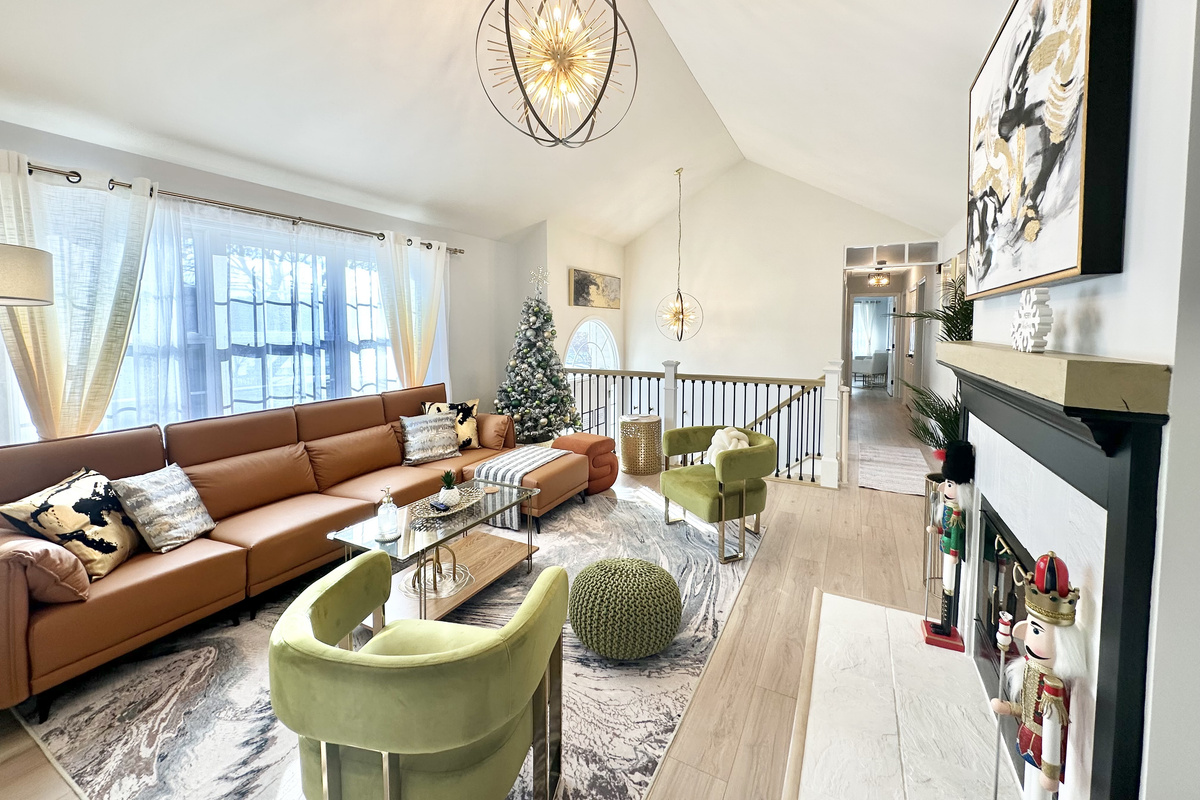 Beautiful living room with soaring vaulted ceilings. A festive Christmas tree will be set up for the holiday season! 🎄