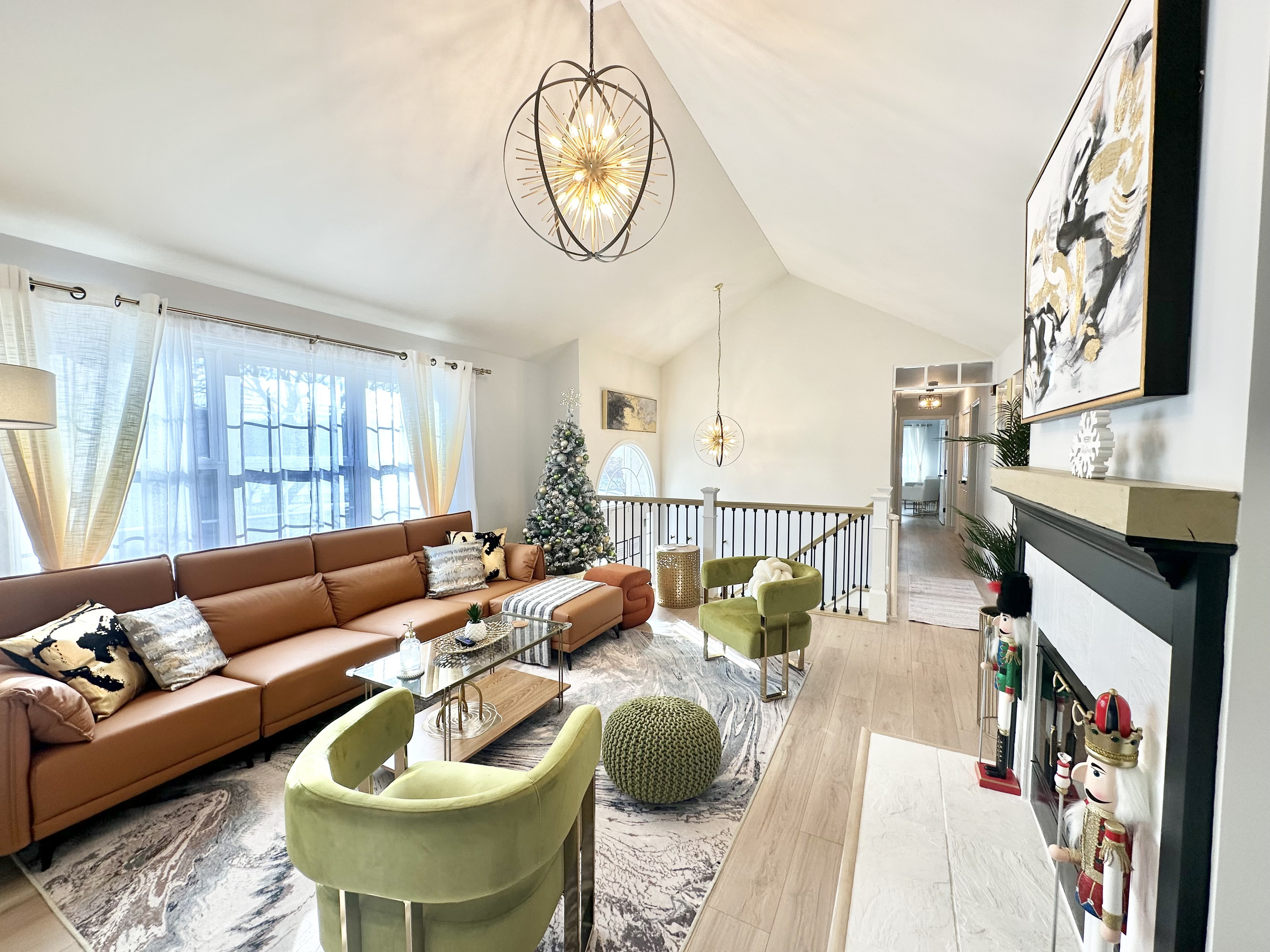 Beautiful living room with soaring vaulted ceilings. A festive Christmas tree will be set up for the holiday season! 🎄