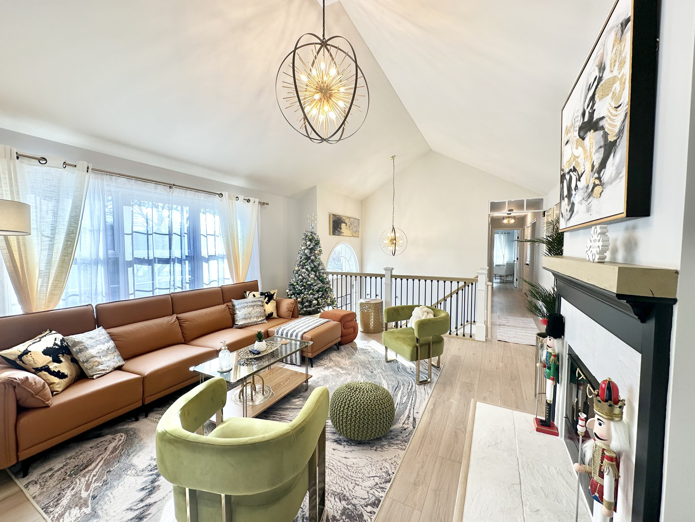 Beautiful living room with soaring vaulted ceilings. A festive Christmas tree will be set up for the holiday season! 🎄