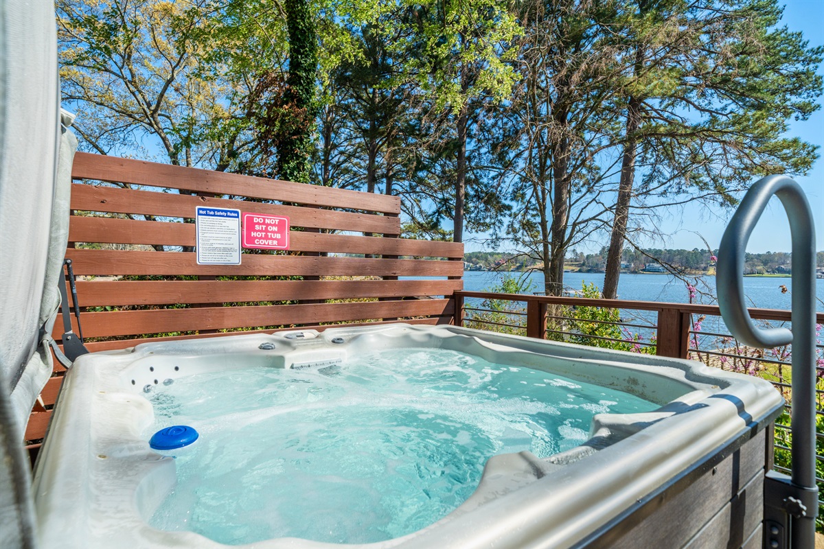 Soak and relax in the private hot tub, perfectly tucked away to offer a more peaceful and intimate outdoor experience.
