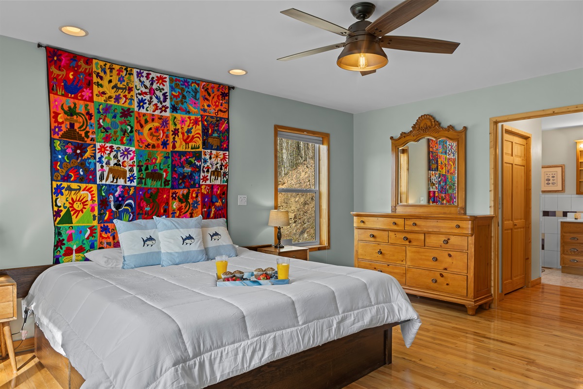 King Bedroom 2: Vibrant mural and sunlit spaces invite you to unwind in style!