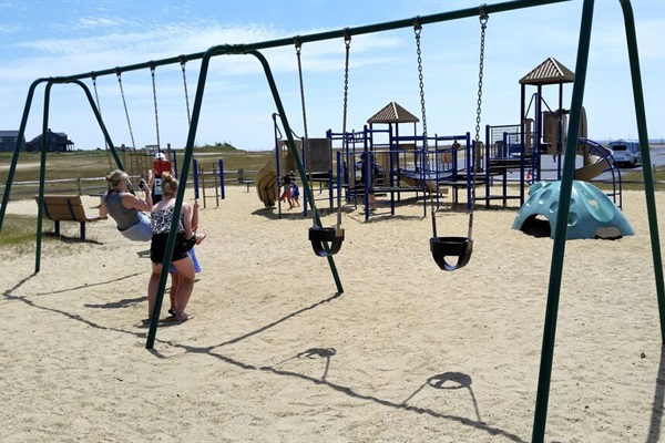 Great playground down the street at Tom Never Beach - swings!