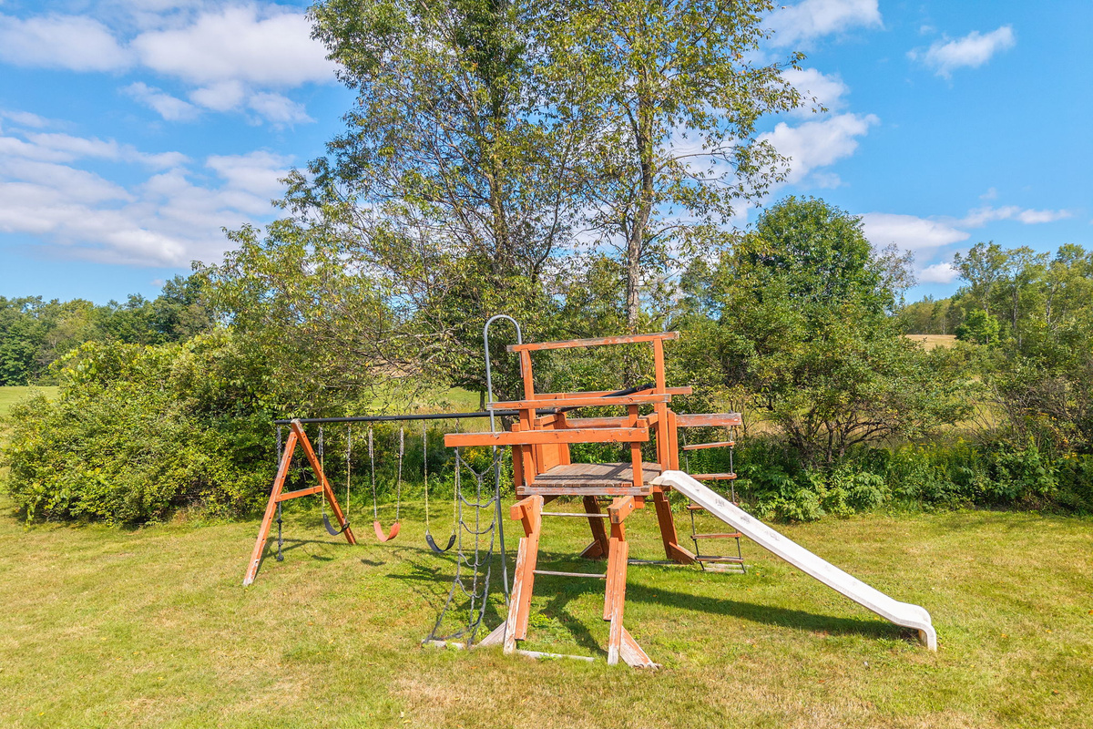 A shared playset gives younger guests a place to enjoy the outdoors.