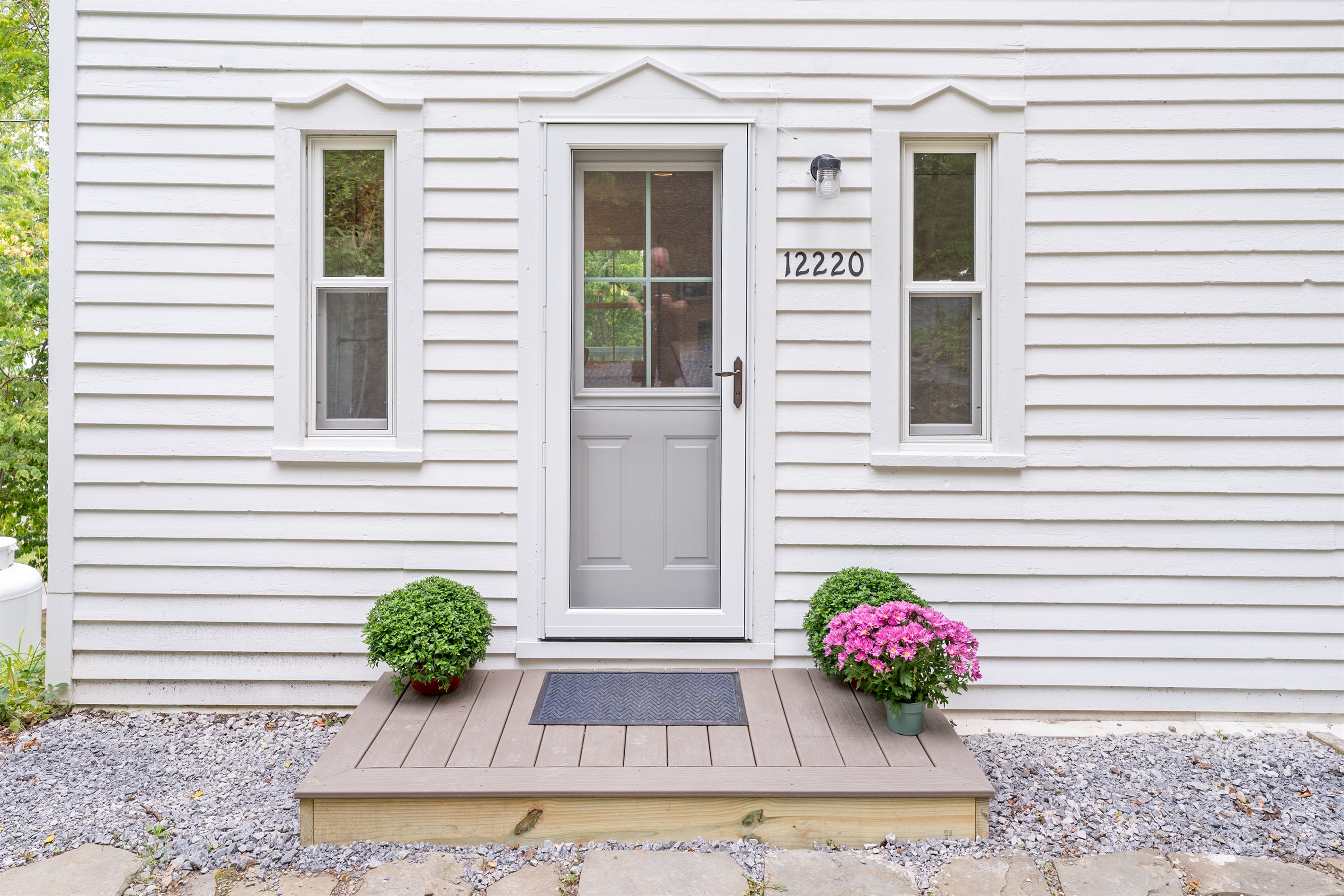 Charming entryway with fresh blooms and a welcoming design that sets the tone for a cozy stay.