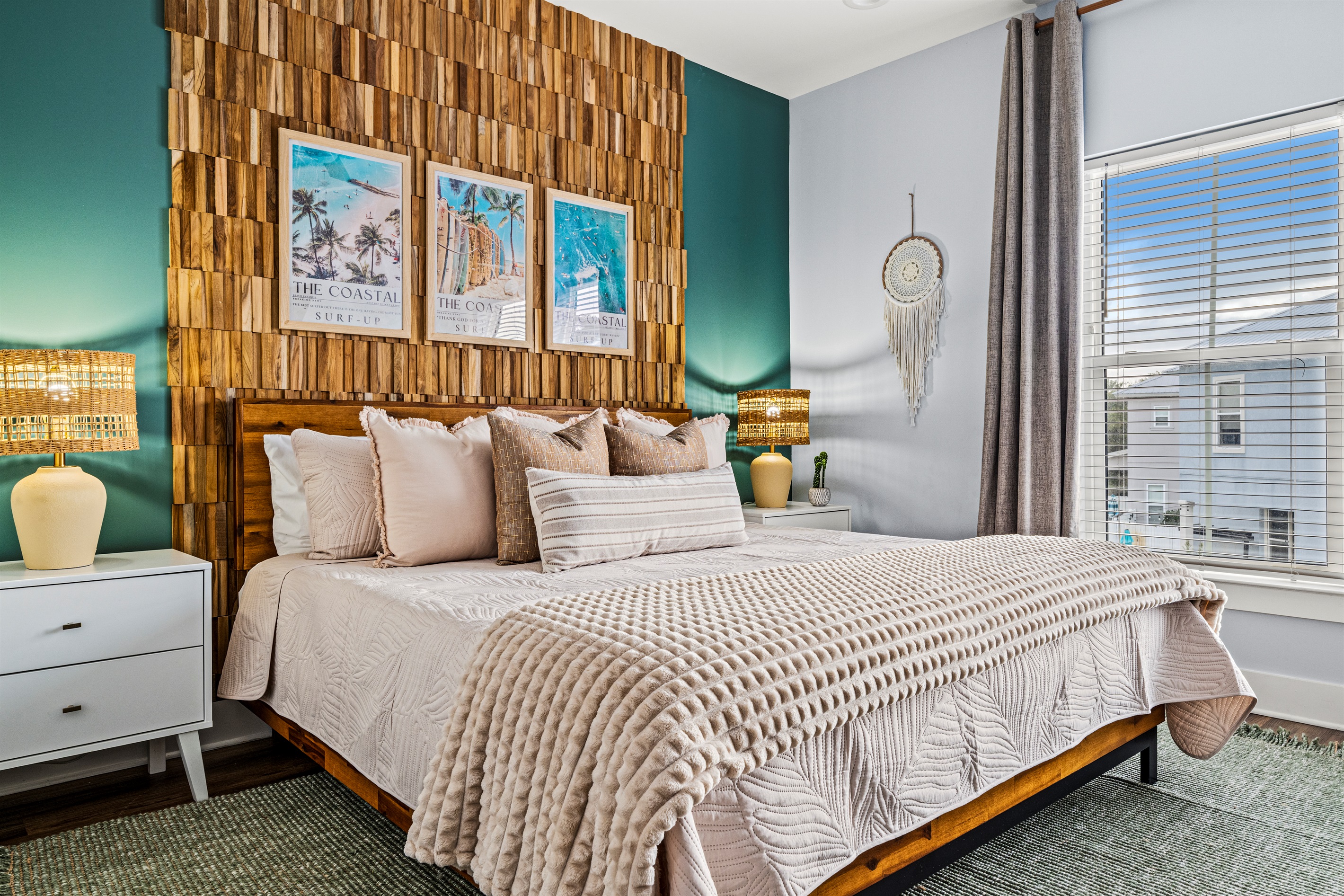 A stunning coastal retreat with a beautiful wood feature wall and soft textures throughout. The perfect bedroom for restful nights during your Destin getaway.