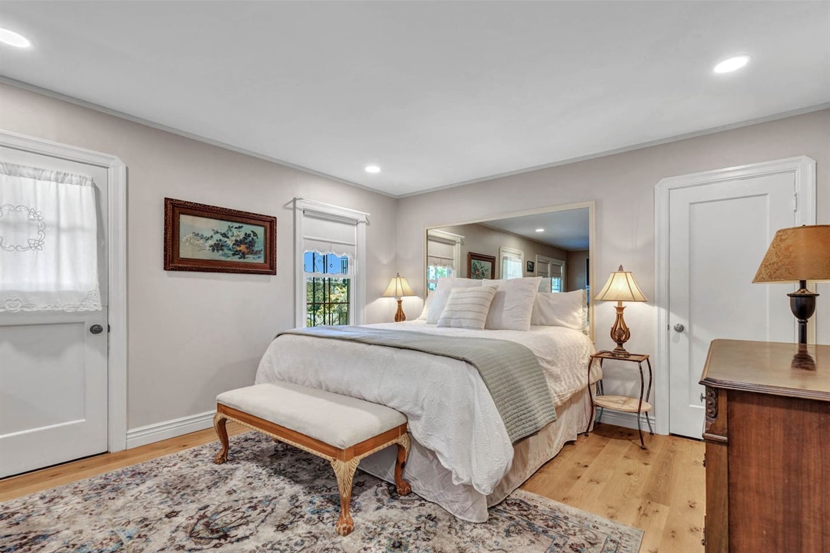 Bedroom on first floor, with private entrance, full bathroom and king bed. 