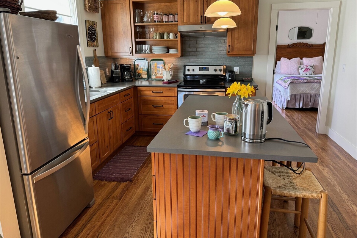 Tea, anyone? Custom kitchen with new appliances and many cooking accessories