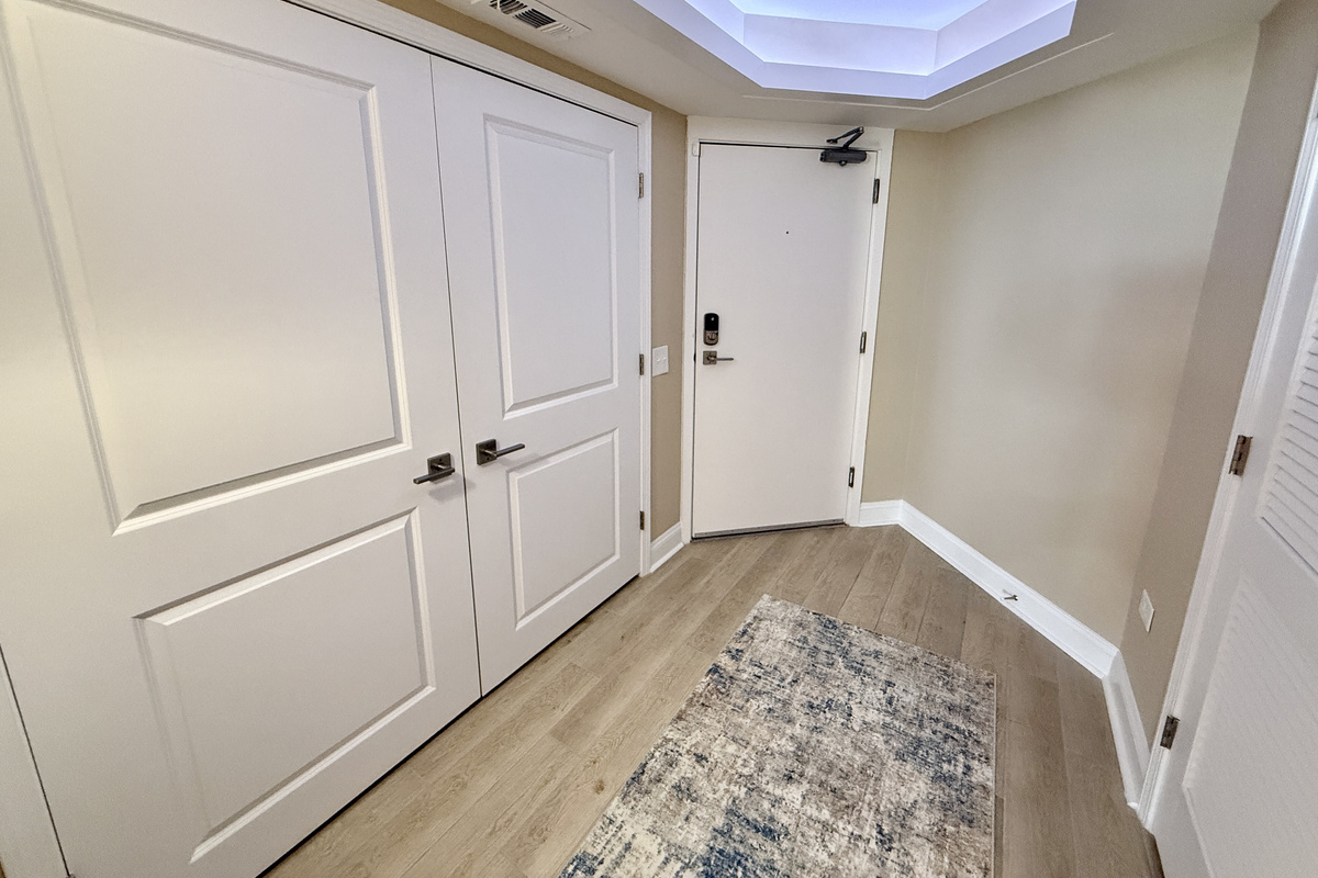 Foyer with Tray Ceiling and Washer/Dryer in Closet