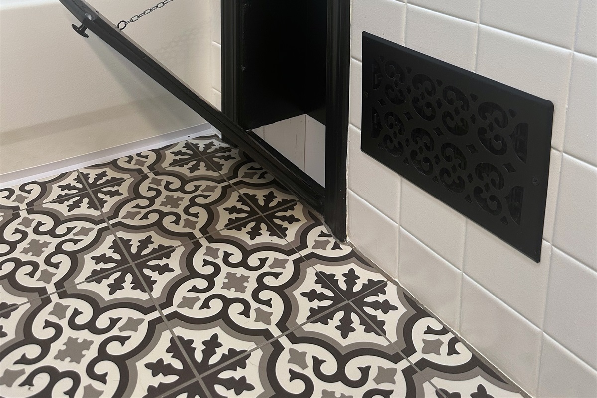 Open laundry chute located in the main bathroom, dropping directly to the basement laundry area in front of the washer and dryer for convenient extended-stay living.