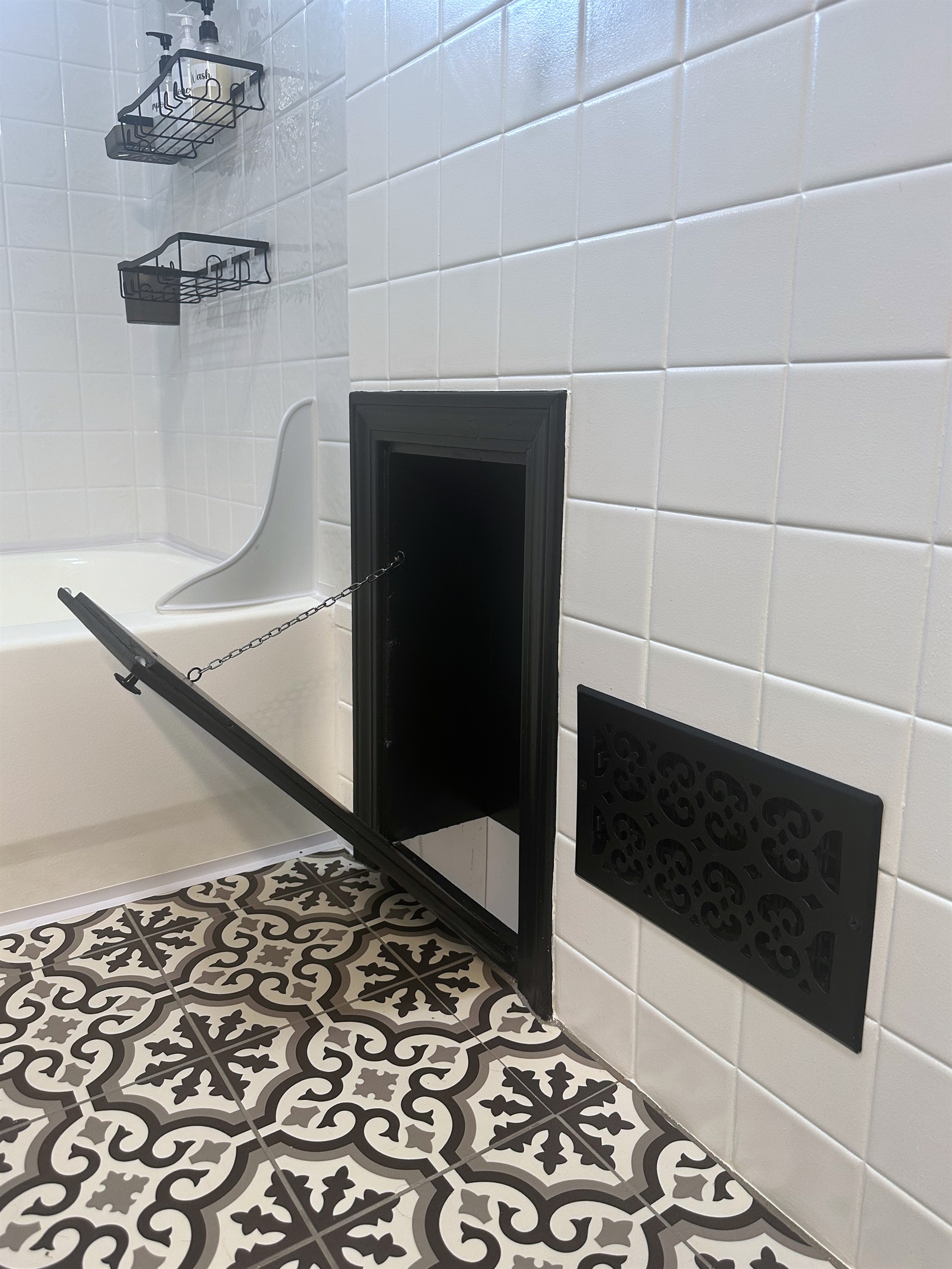 Open laundry chute located in the main bathroom, dropping directly to the basement laundry area in front of the washer and dryer for convenient extended-stay living.