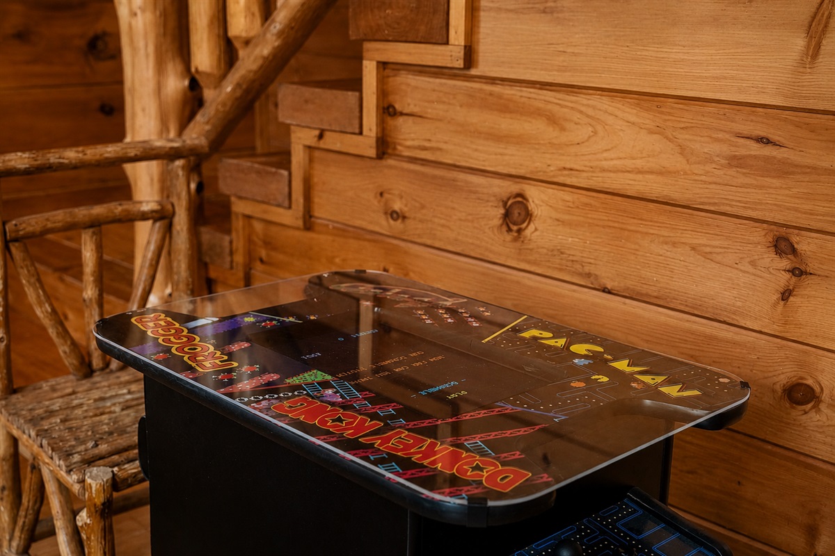 Bring out your competitive side with the multicade arcade table featuring classic favorites like Pac-Man and Donkey Kong