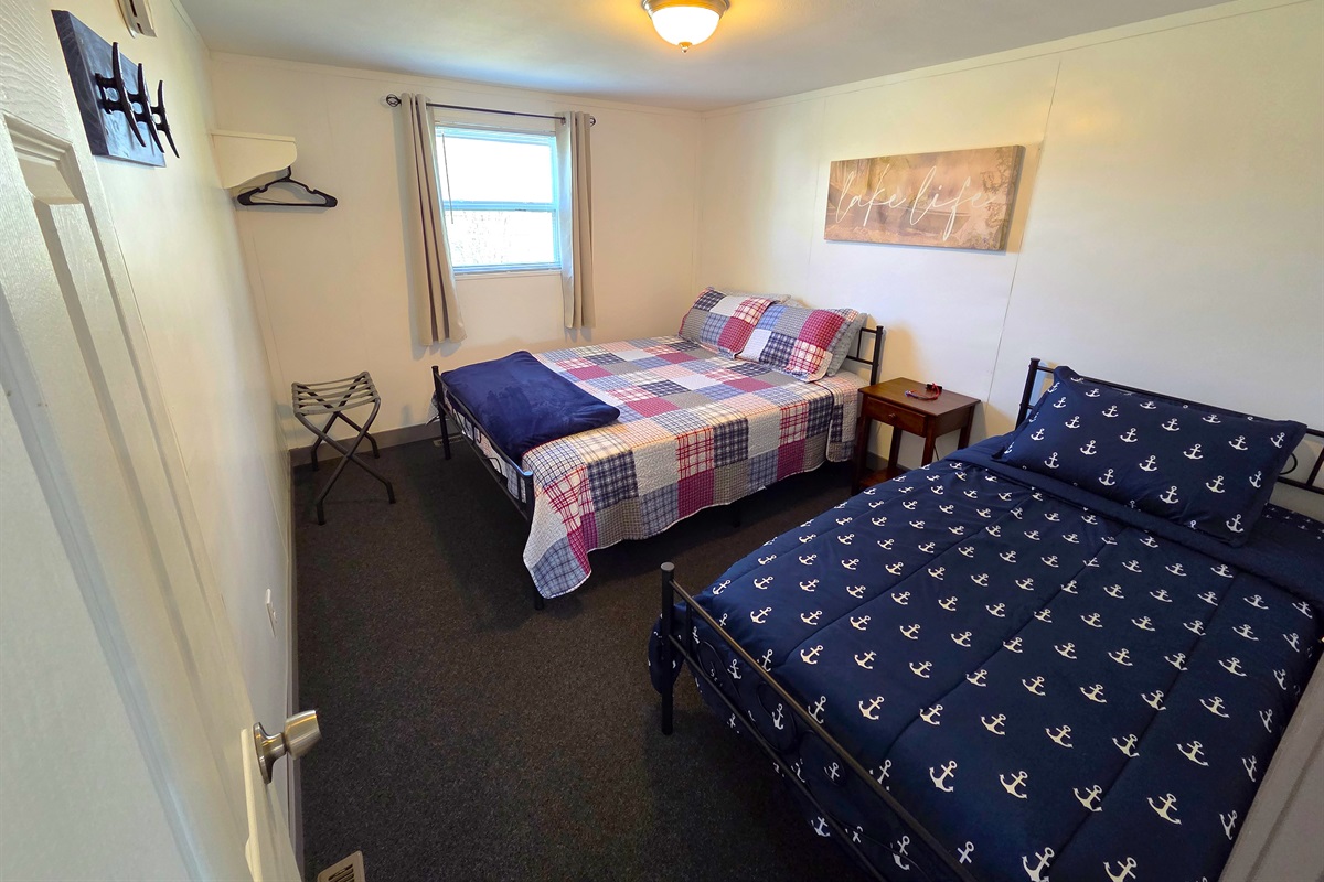 Bedroom 3 has a queen and twin bed. It's located ust off the 3/4 shower bath.