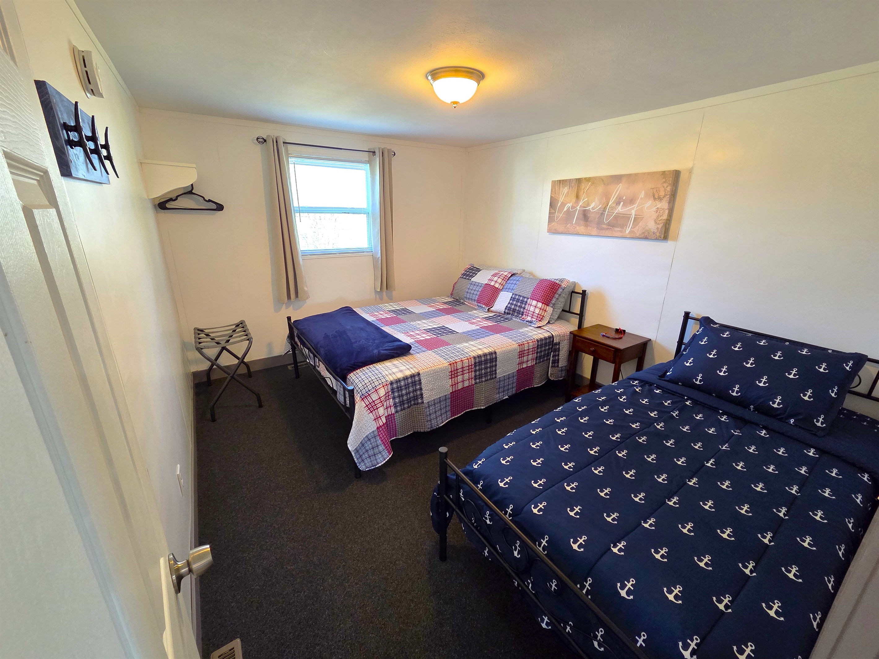 Bedroom 3 has a queen and twin bed. It's located ust off the 3/4 shower bath.