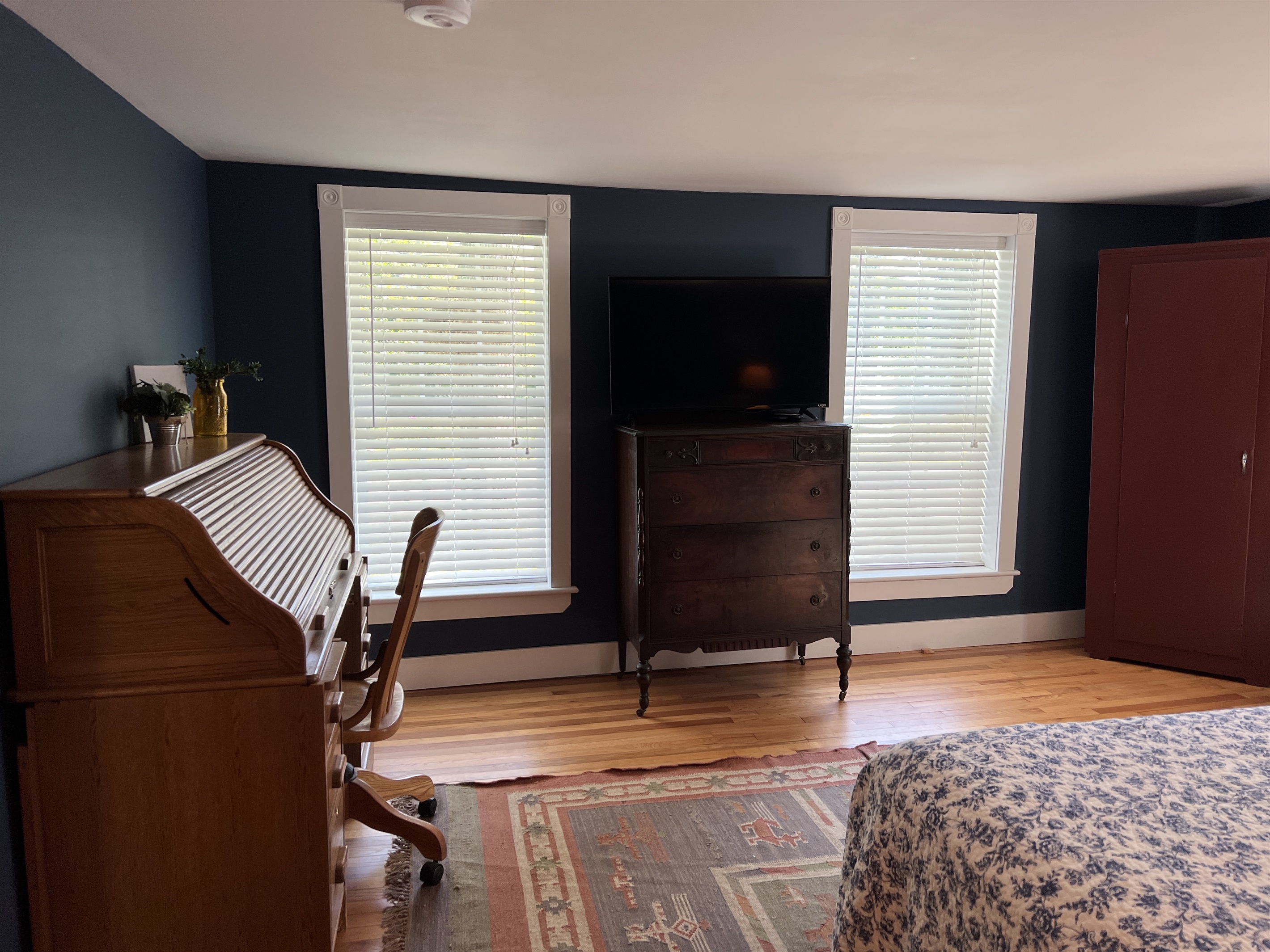 1st Floor queen bedroom w/ desk area.
