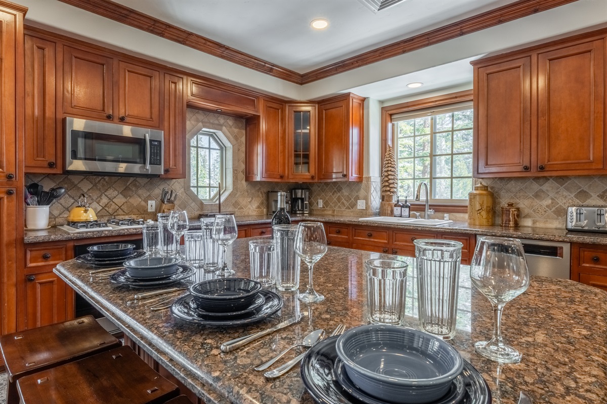 The breakfast bar offers easy seating for quick meals, après snacks, or keeping the cook company.