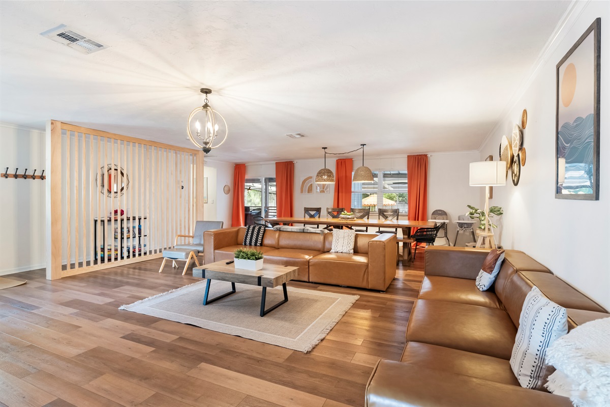 Newly decorated! Huge boho themed living room with 12-foot long custom dining table.
