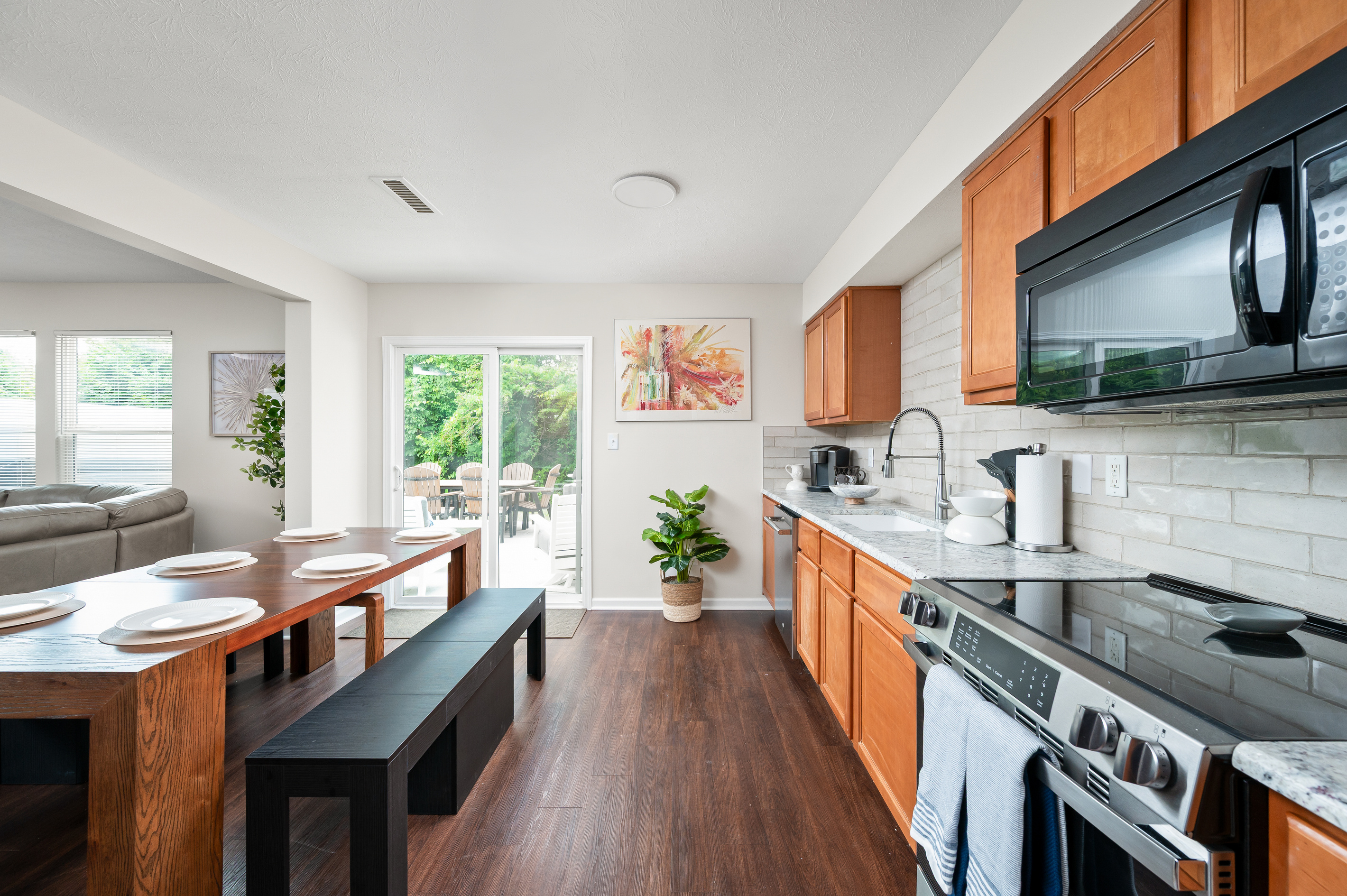 The open-concept kitchen keeps everyone connected, whether you're preparing a meal, grabbing a quick snack, or gathering with family and friends before heading out for the day.