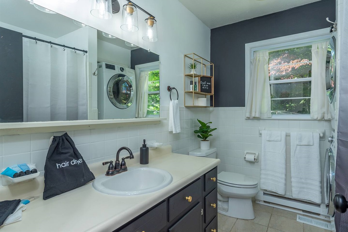 Full Bath off hall- Extra clean, hanging 1 large bath Towel,  bathmat located on back of door. Amenities: hair dryer shampoo, conditioner, body wash & lotion, 2  black wc 4 make up removal. TP, tissue FIRST AID KIT located under sink. C draws extras