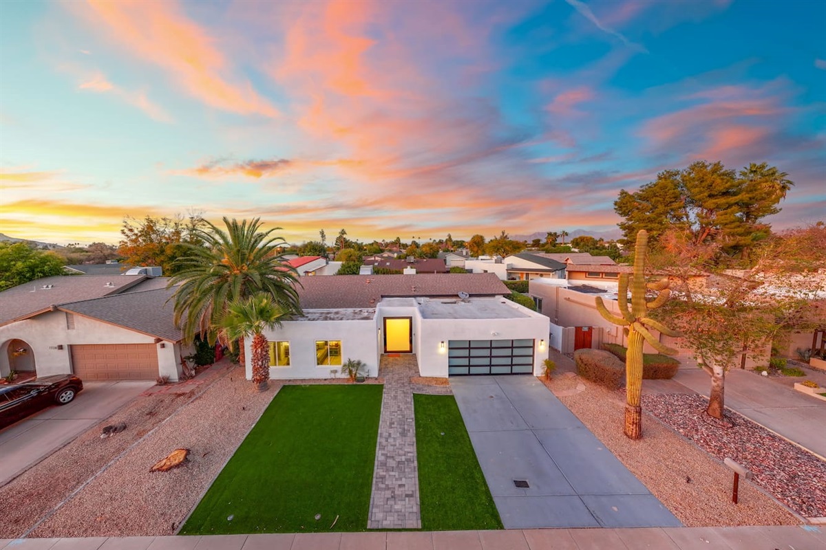 Catch the sunset glow as this modern desert gem lights up the neighborhood.

