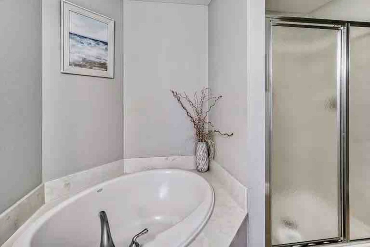 Bedroom 1, Large Bathroom, tub and private shower.
