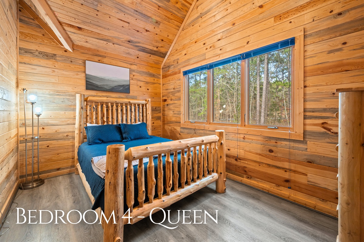 Featuring a comfortable queen bed and warm wood accents, this bedroom offers a quiet and relaxing space where guests can fully unwind at the end of the day.