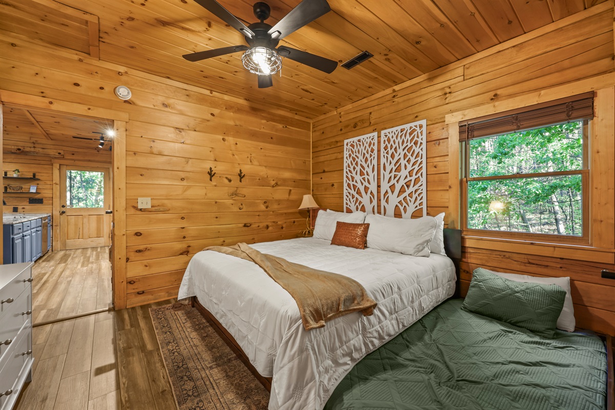 Primary suite upstairs with a king bed and a twin XL trundle