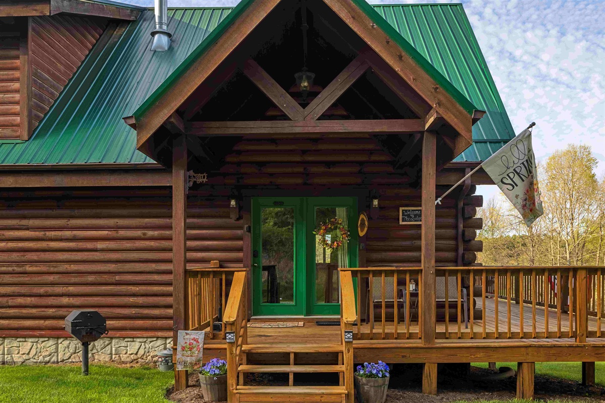 The front door area with the charcoal grill off to the side.