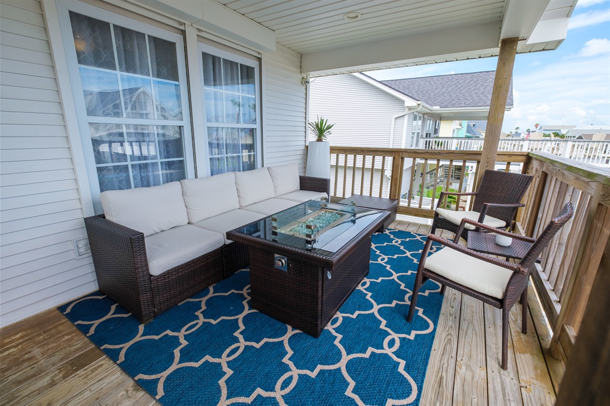 Upstairs lounging area with a fire table for those chilly nights
