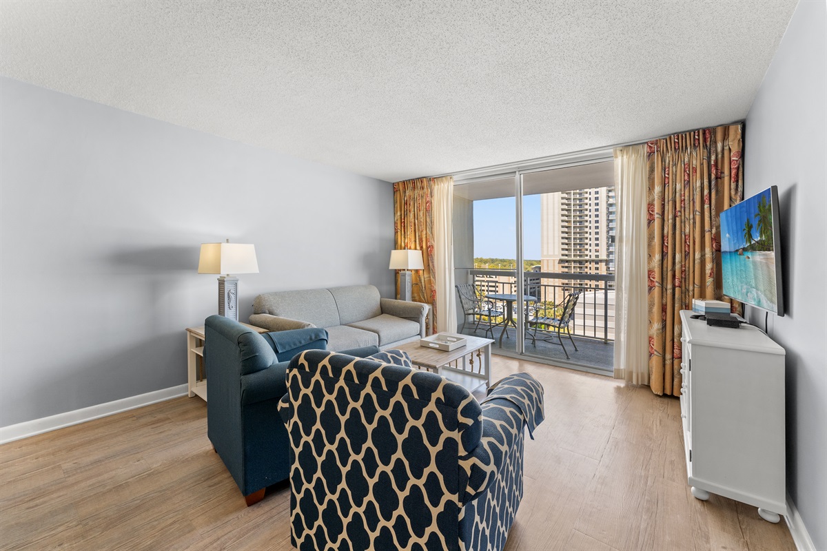 Spacious Living Room with sleeper sofa and  balcony access