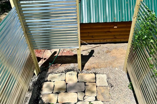 This outdoor shower features hot water with clean well water 