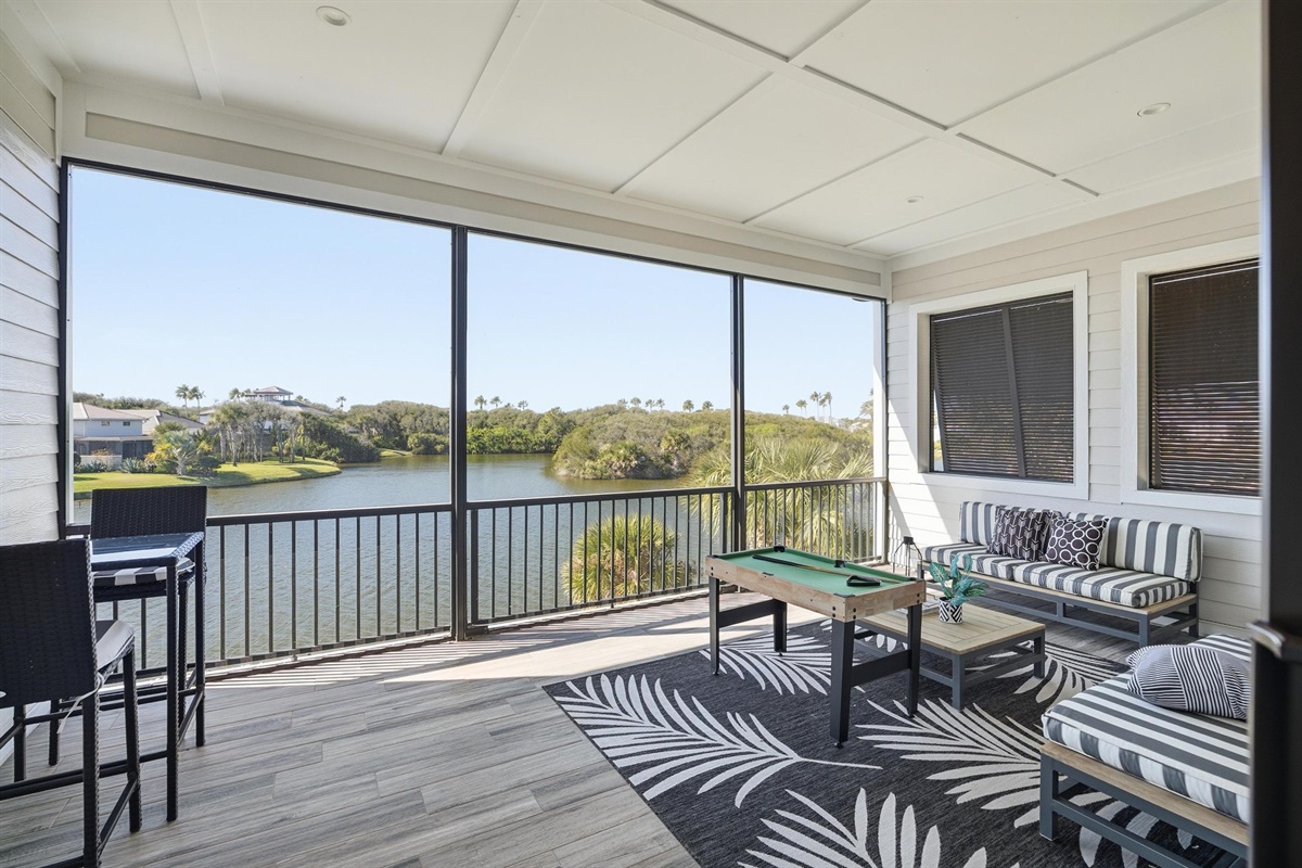 Screened lanai with water views + game time vibes 🌴🎱
Kick back on the comfy lounge seating, sip your morning coffee, and enjoy breezy lake views—then challenge the crew to a round of mini pool for the perfect vacation hangout.