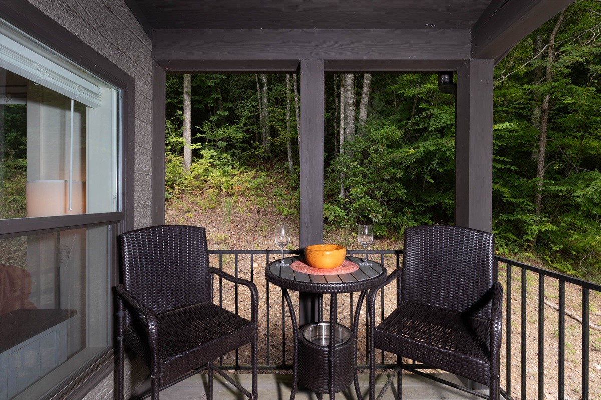 Gather on the covered porch—perfect for evening drinks under the glow of warm lights.