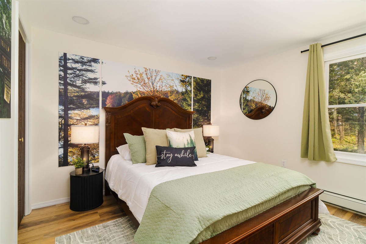 🛏️ The Lyman Run Forest Room — a cozy queen with a woodland feel.