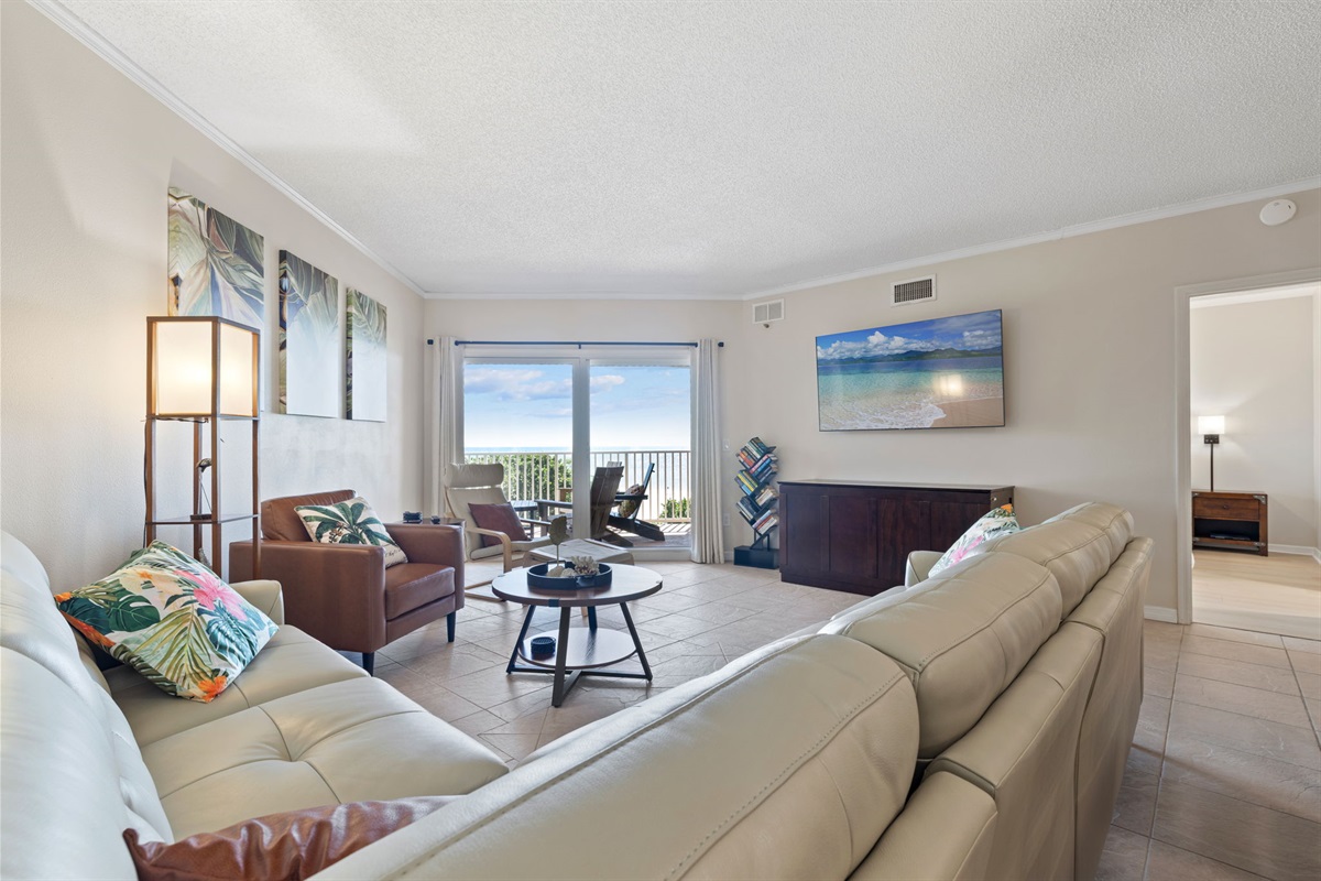 Living room open to the dining and kitchen area with gulf views (murphy bed sleeps 2).